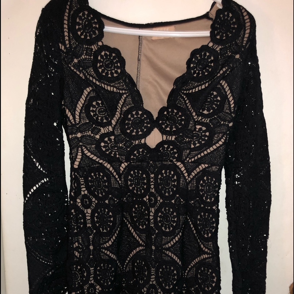 Love Triangle lace dress with nude lining .